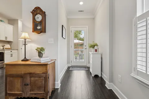 a view of kitchen with furniture and wooden floor