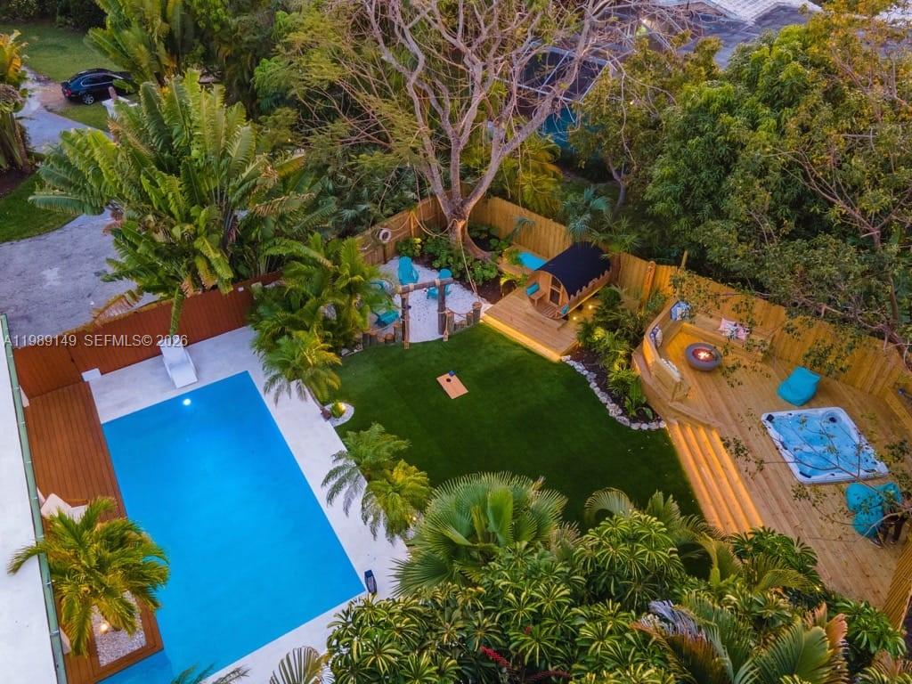 18490 Southwest 83rd Place Cutler Bay, FL 33157 - Photo 2 of 84 an aerial view of a house a yard and mountain view