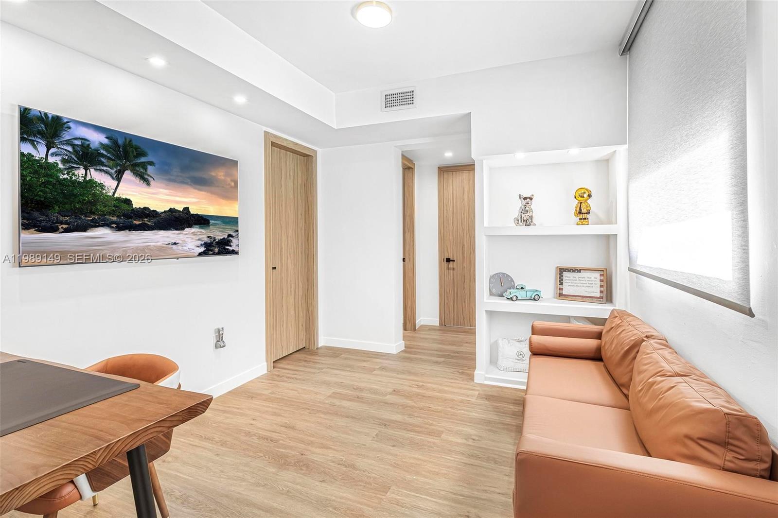 18490 Southwest 83rd Place Cutler Bay, FL 33157 - Photo 21 of 84 a living room with furniture and a flat screen tv
