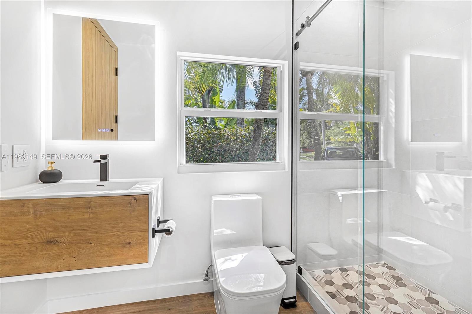 18490 Southwest 83rd Place Cutler Bay, FL 33157 - Photo 28 of 84 a bathroom with a sink a toilet and shower