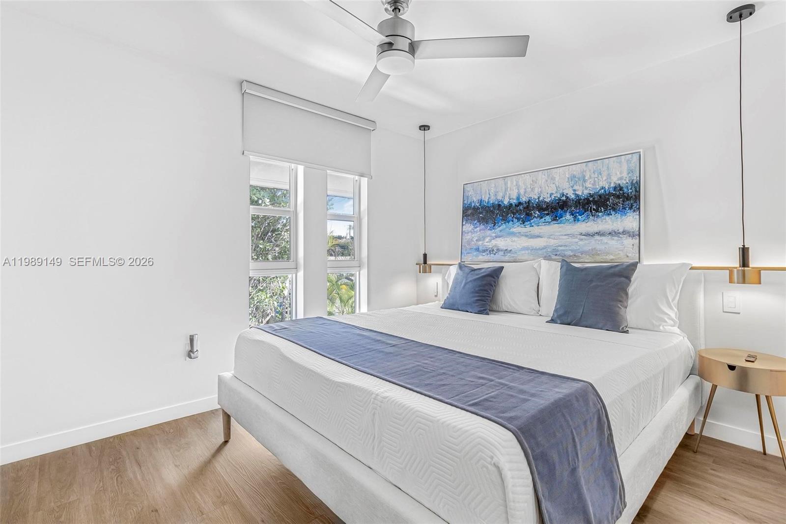 18490 Southwest 83rd Place Cutler Bay, FL 33157 - Photo 40 of 84 a spacious bedroom with a bed and a window
