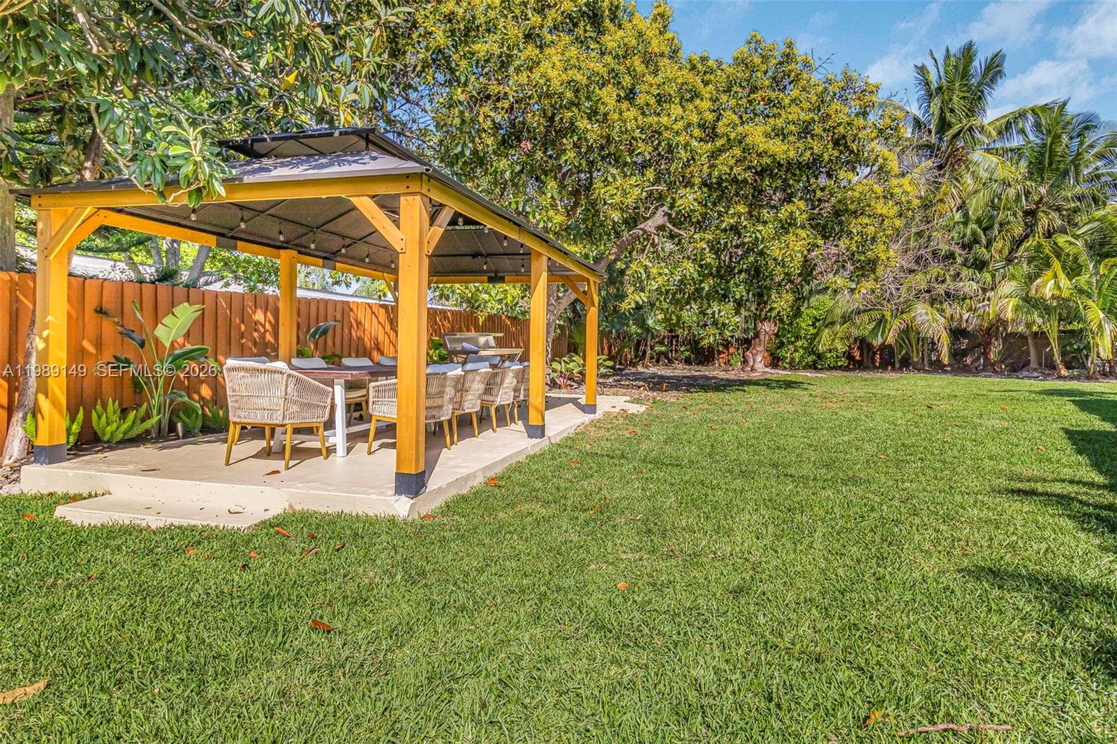 18490 Southwest 83rd Place Cutler Bay, FL 33157 - Photo 52 of 84 a view of a house with backyard and sitting area