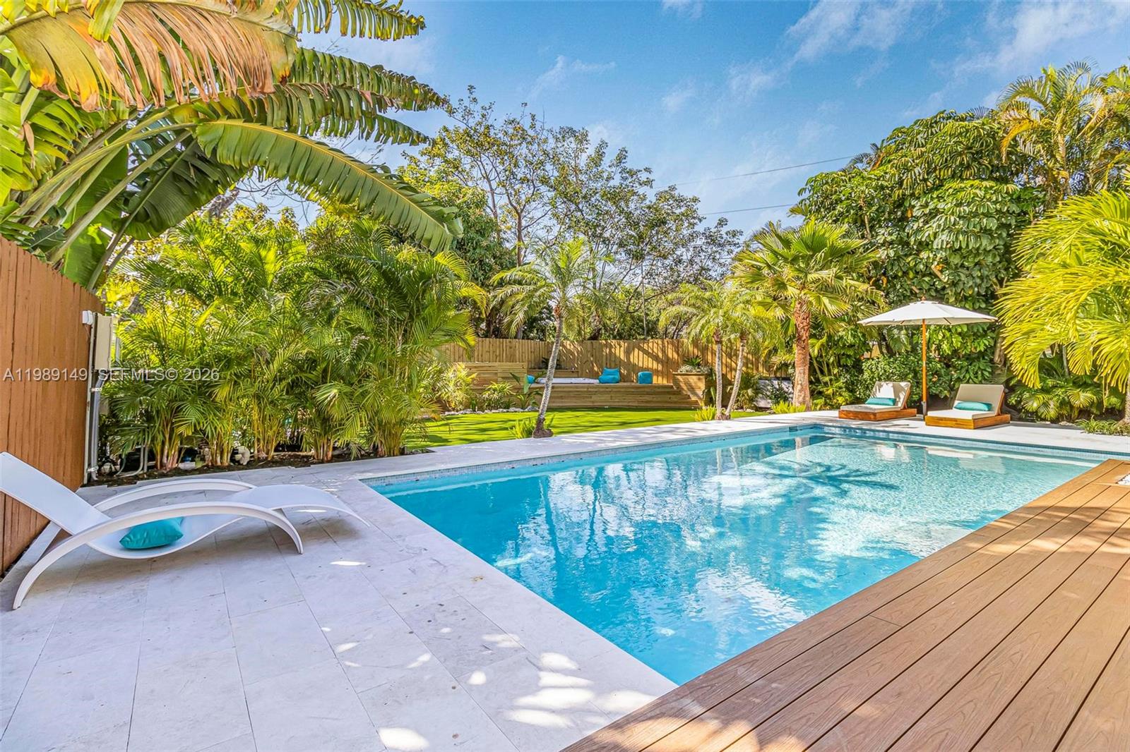 18490 Southwest 83rd Place Cutler Bay, FL 33157 - Photo 58 of 84 a view of swimming pool with a sitting area
