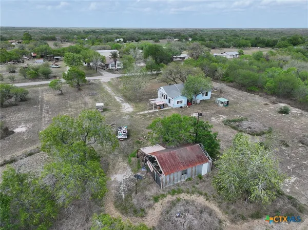 an aerial view of a house with a garden
