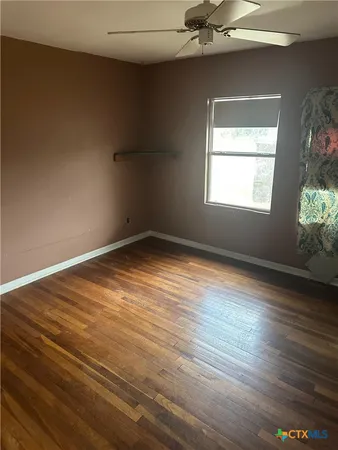 a stove top oven sitting inside of a kitchen