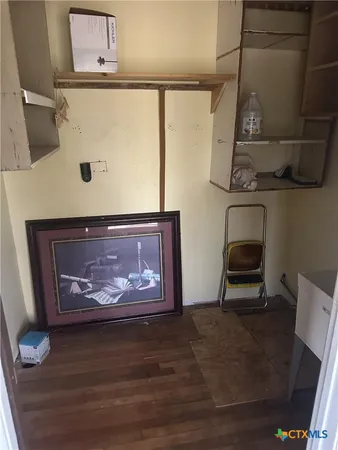 a bathroom with a sink vanity and tub