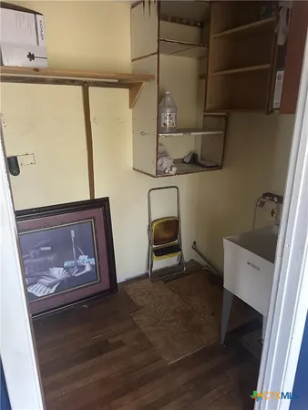 a room with a sink and a mirror