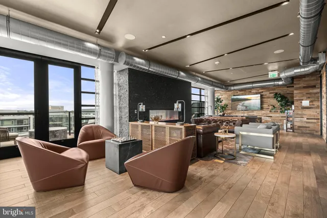 a room with wooden floors table and chairs