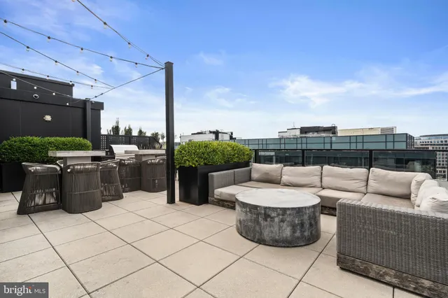a view of a patio with couches and chairs