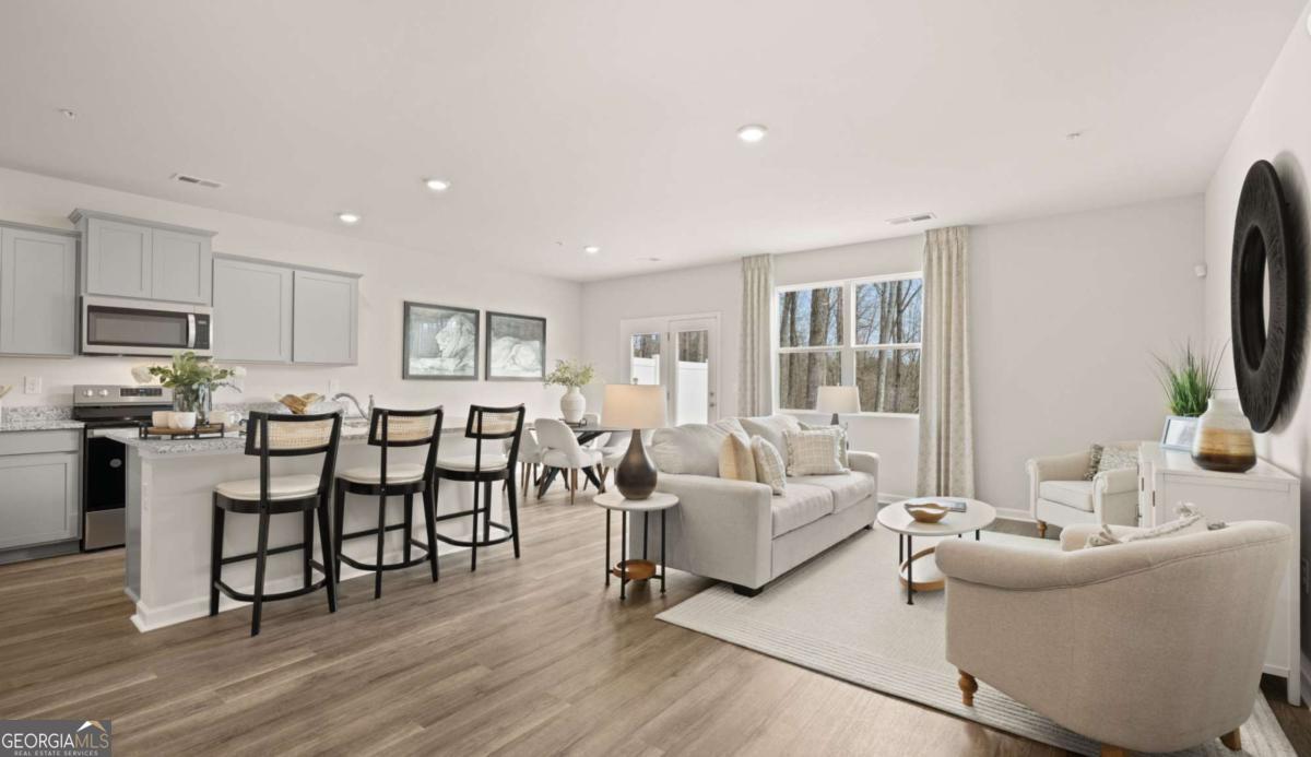 237 Sound Circle Stockbridge, GA 30281 - Photo 14 of 67 a living room with furniture and a flat screen tv