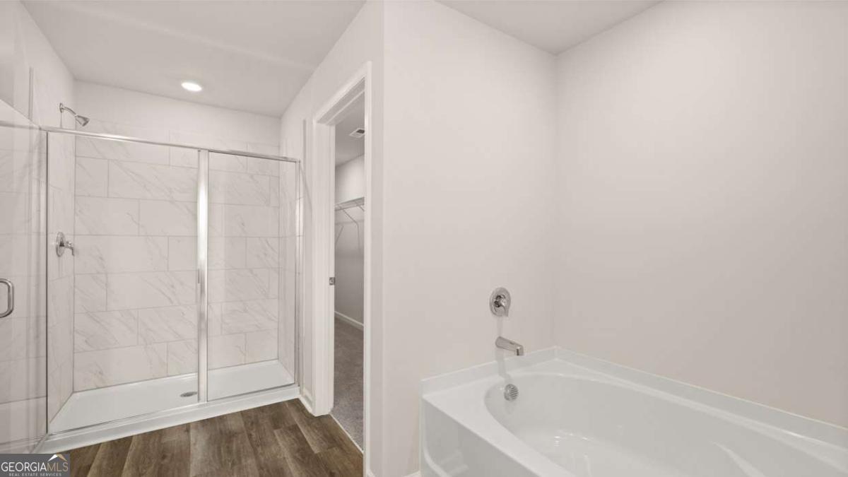 237 Sound Circle Stockbridge, GA 30281 - Photo 20 of 67 a bathroom with a bathtub and a shower