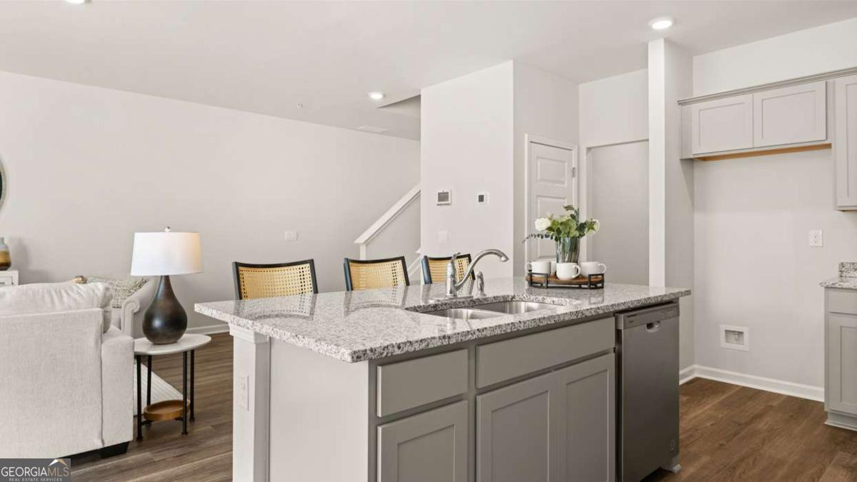 237 Sound Circle Stockbridge, GA 30281 - Photo 22 of 67 a bathroom with a granite countertop sink and a mirror