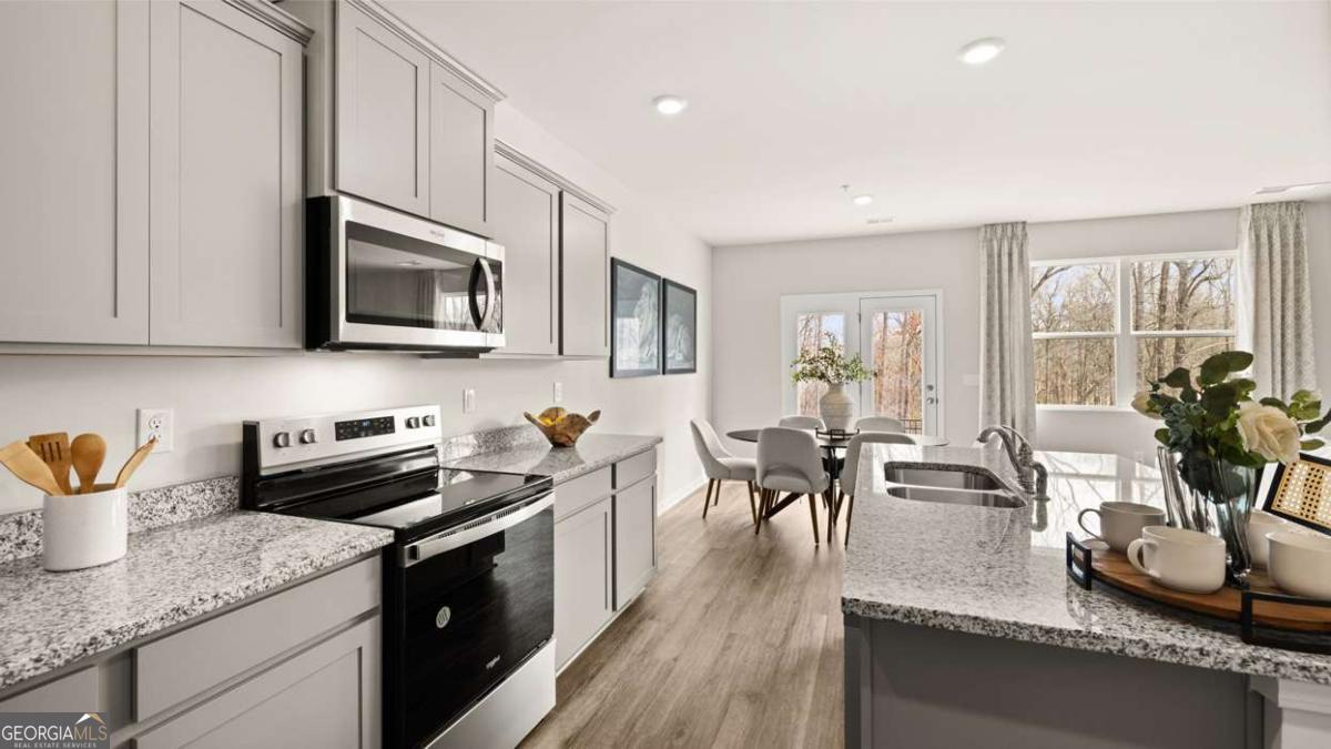 237 Sound Circle Stockbridge, GA 30281 - Photo 23 of 67 a kitchen with granite countertop lots of counter top space