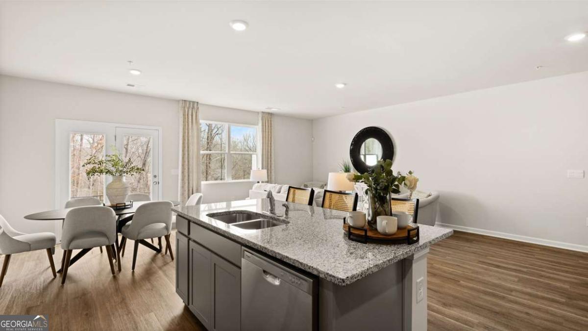 237 Sound Circle Stockbridge, GA 30281 - Photo 26 of 67 a kitchen with a table and chairs in it