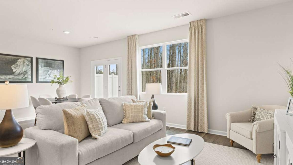 237 Sound Circle Stockbridge, GA 30281 - Photo 33 of 67 a living room with furniture and a large window