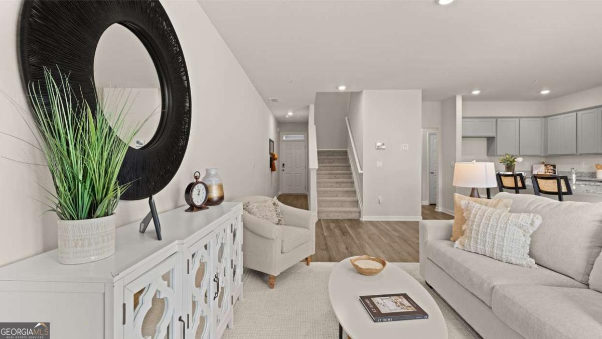 237 Sound Circle Stockbridge, GA 30281 - Photo 36 of 67 a living room with furniture and a large window