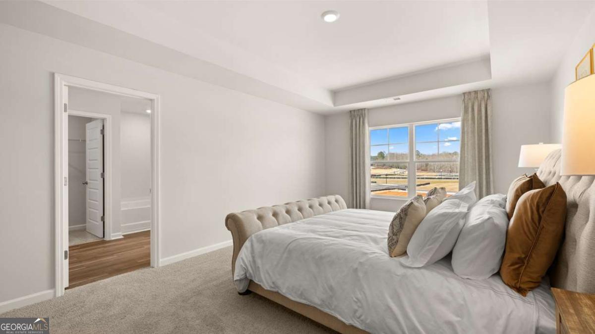 237 Sound Circle Stockbridge, GA 30281 - Photo 40 of 67 a bedroom with a bed and a window