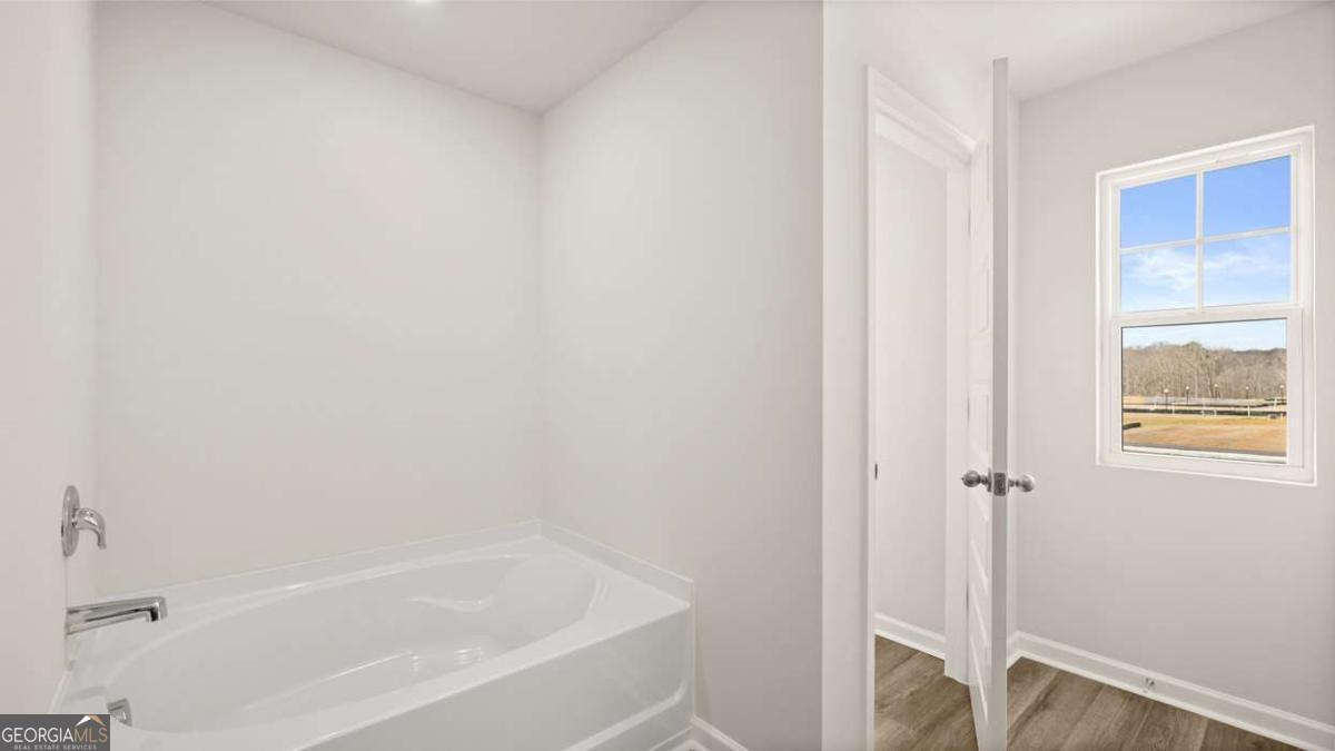 237 Sound Circle Stockbridge, GA 30281 - Photo 44 of 67 a white bath tub sitting next to a window