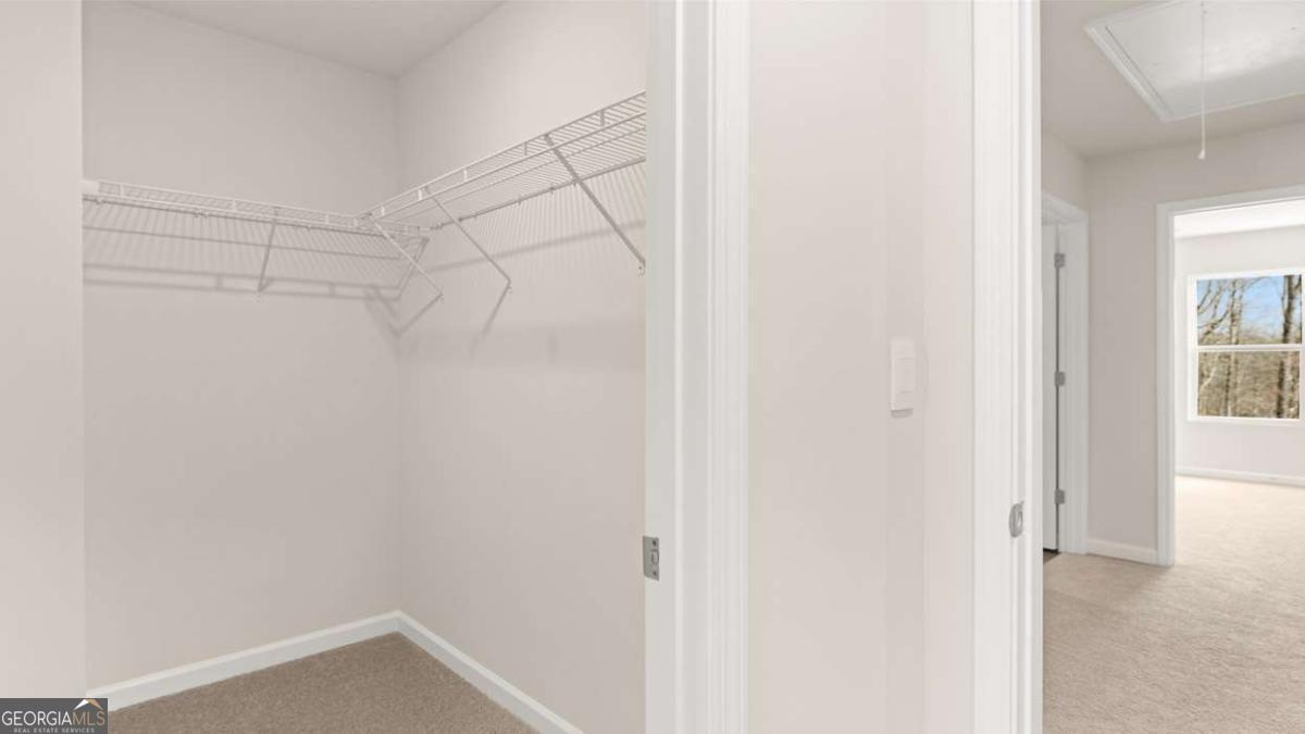 237 Sound Circle Stockbridge, GA 30281 - Photo 46 of 67 a view of a room with racks on the wall