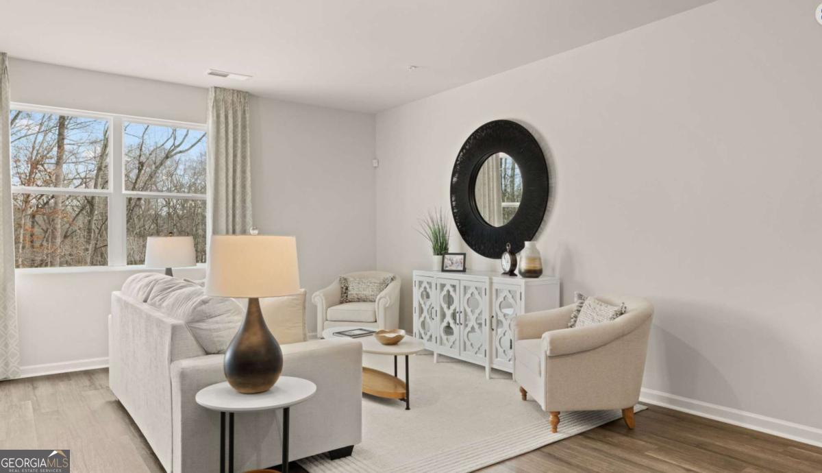 237 Sound Circle Stockbridge, GA 30281 - Photo 60 of 67 a living room with furniture and a large window