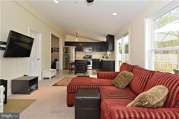 631 Ritchie Avenue Silver Spring, MD 20910 - Photo 12 of 30 a living room with furniture and a flat screen tv