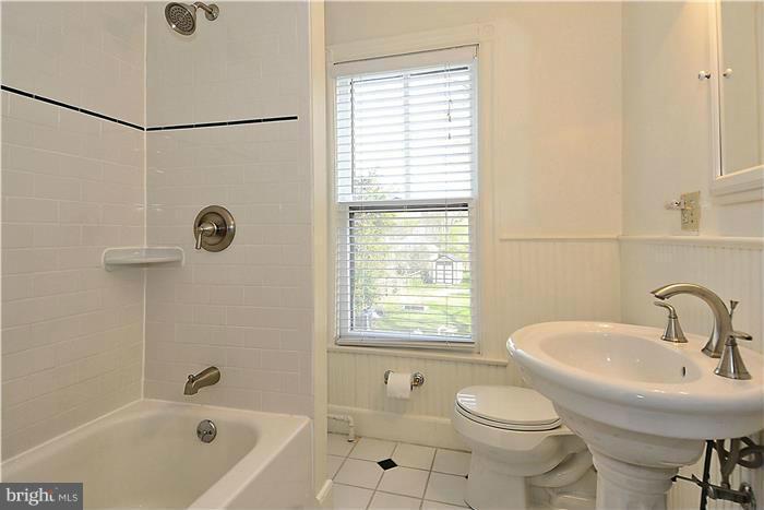 631 Ritchie Avenue Silver Spring, MD 20910 - Photo 20 of 30 a bathroom with a sink a toilet and shower
