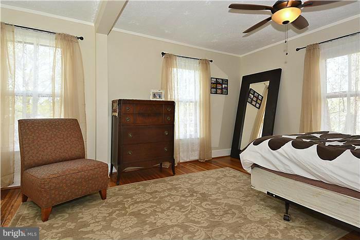 631 Ritchie Avenue Silver Spring, MD 20910 - Photo 24 of 30 a bedroom with furniture and window