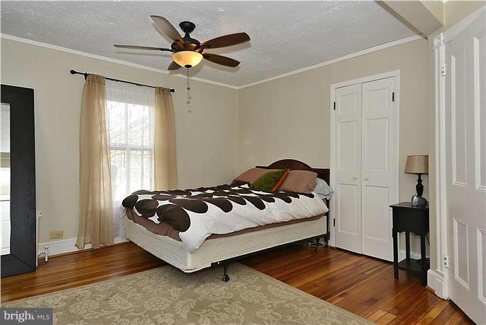 631 Ritchie Avenue Silver Spring, MD 20910 - Photo 25 of 30 a bedroom with a bed and a window