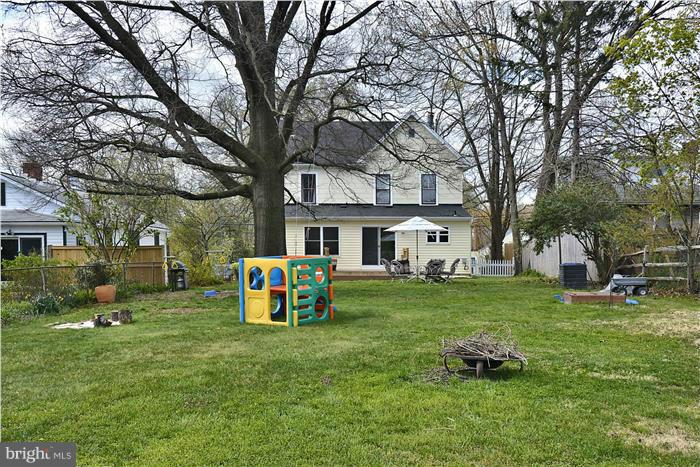 631 Ritchie Avenue Silver Spring, MD 20910 - Photo 26 of 30 a front view of a house with garden and trees