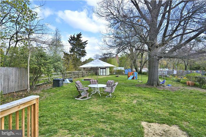 631 Ritchie Avenue Silver Spring, MD 20910 - Photo 28 of 30 a backyard of a house with table and chairs