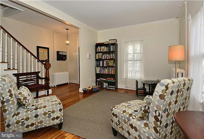 631 Ritchie Avenue Silver Spring, MD 20910 - Photo 5 of 30 a bedroom with furniture and a large window