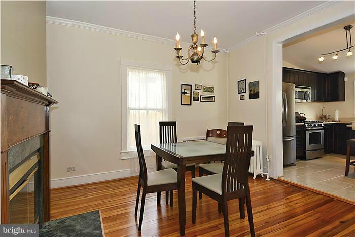 631 Ritchie Avenue Silver Spring, MD 20910 - Photo 8 of 30 a view of a dining room with furniture and wooden floor