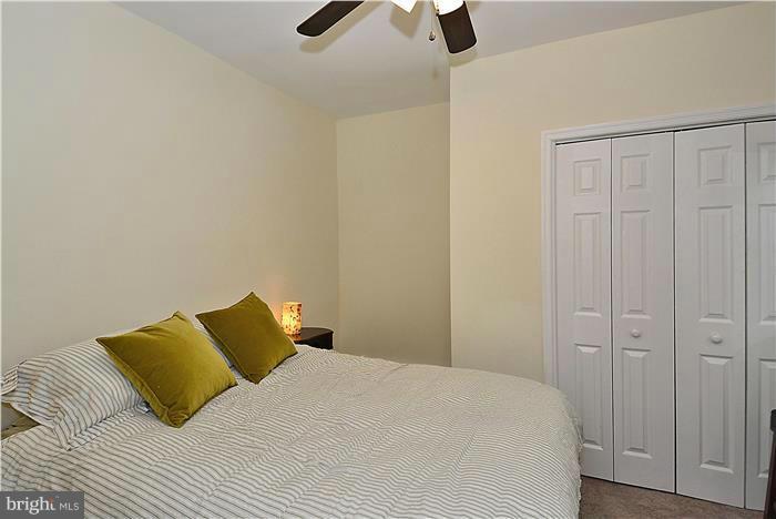 631 Ritchie Avenue Silver Spring, MD 20910 - Photo 9 of 30 a bedroom with a bed and painting on the wall