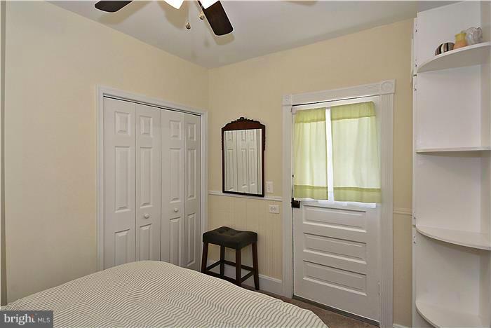 631 Ritchie Avenue Silver Spring, MD 20910 - Photo 10 of 30 a bedroom with a bed and a chair