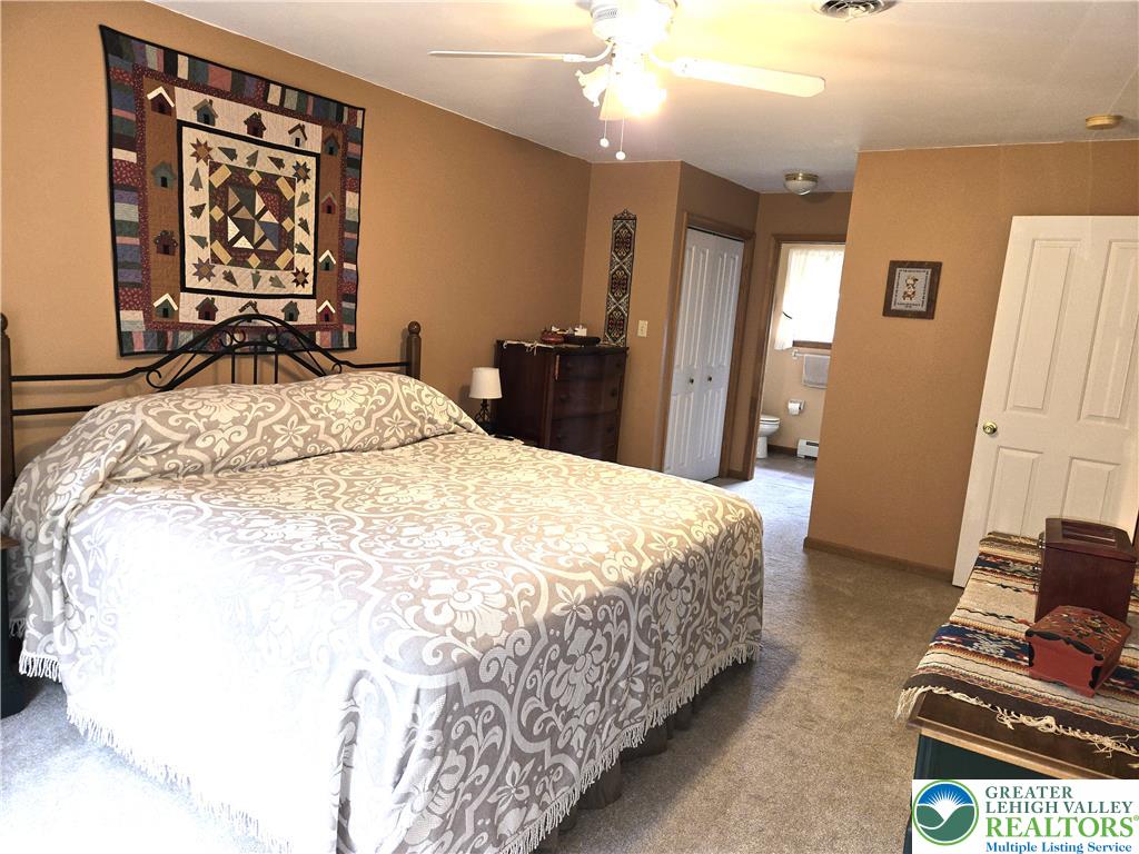 477 Quiet Valley Road Mount Bethel, PA 18343 - Photo 39 of 53 A restful retreat with neutral tones and soft carpeting, offering a peaceful atmosphere.