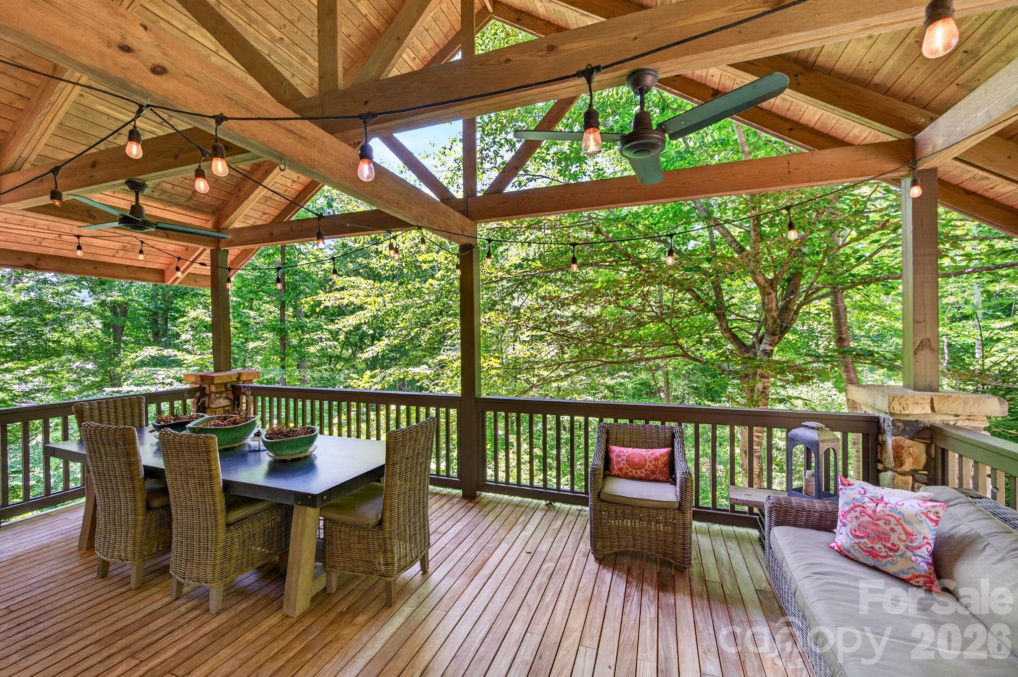 235 Bull Creek Road Asheville, NC 28805 - Photo 17 of 47 a view of a two chairs in the deck next to a yard