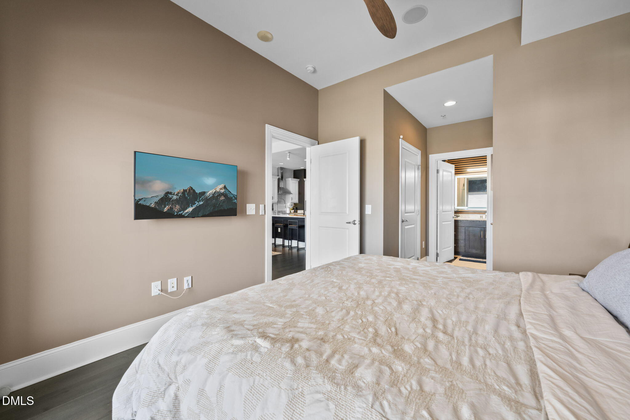 400 West North Street, Unit 1218 Raleigh, NC 27603 - Photo 19 of 41 a bedroom with a large bed and a chandelier
