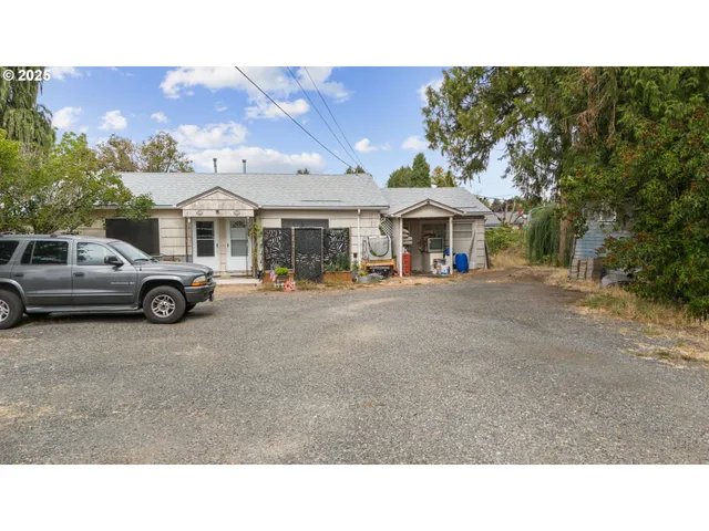 a backyard of a house with outdoor seating