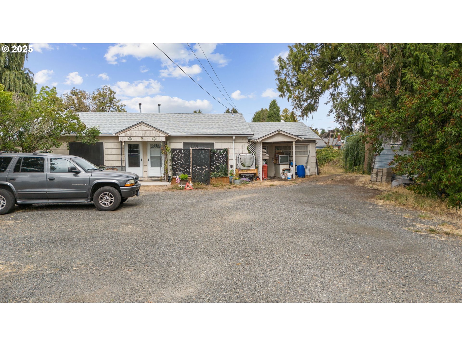 233 Spring Creek Drive Eugene, OR 97404 - Photo 3 of 20 a black and white house with a outdoor space