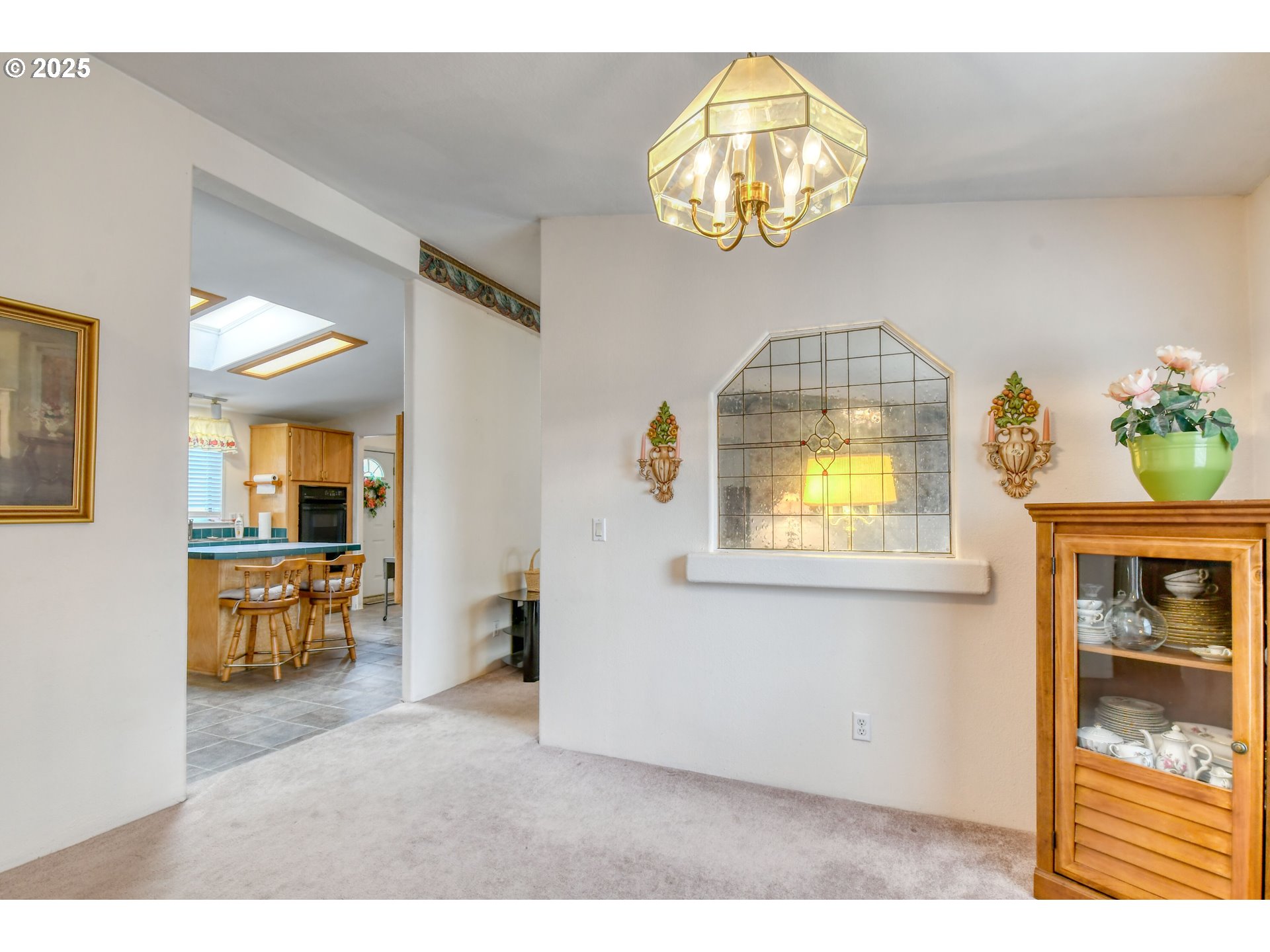 415 Northeast 40th Street Pendleton, OR 97801 - Photo 11 of 36 a view of livingroom with kitchen view and a chandelier