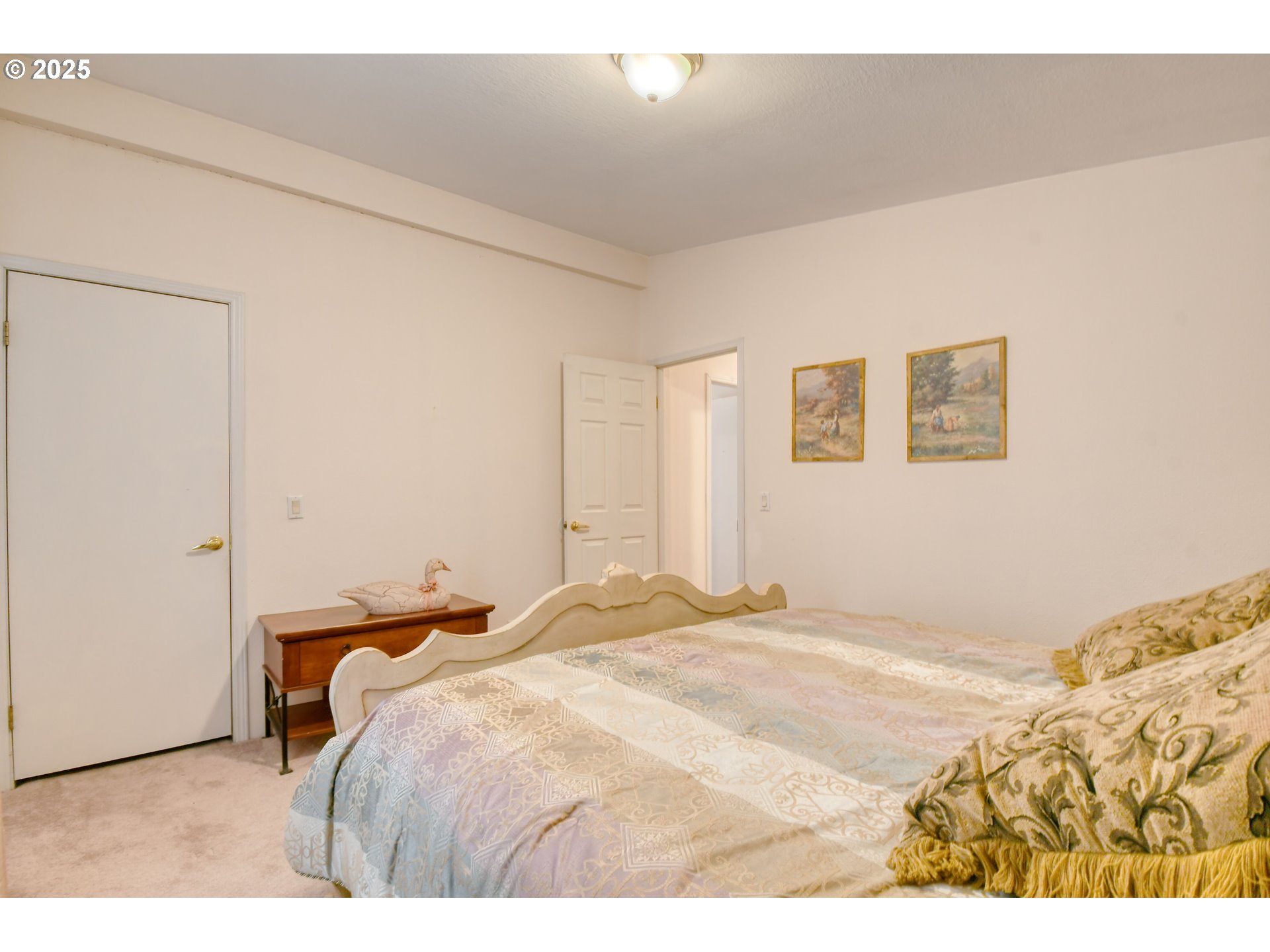 415 Northeast 40th Street Pendleton, OR 97801 - Photo 26 of 36 a bedroom with a bed and a painting on the wall