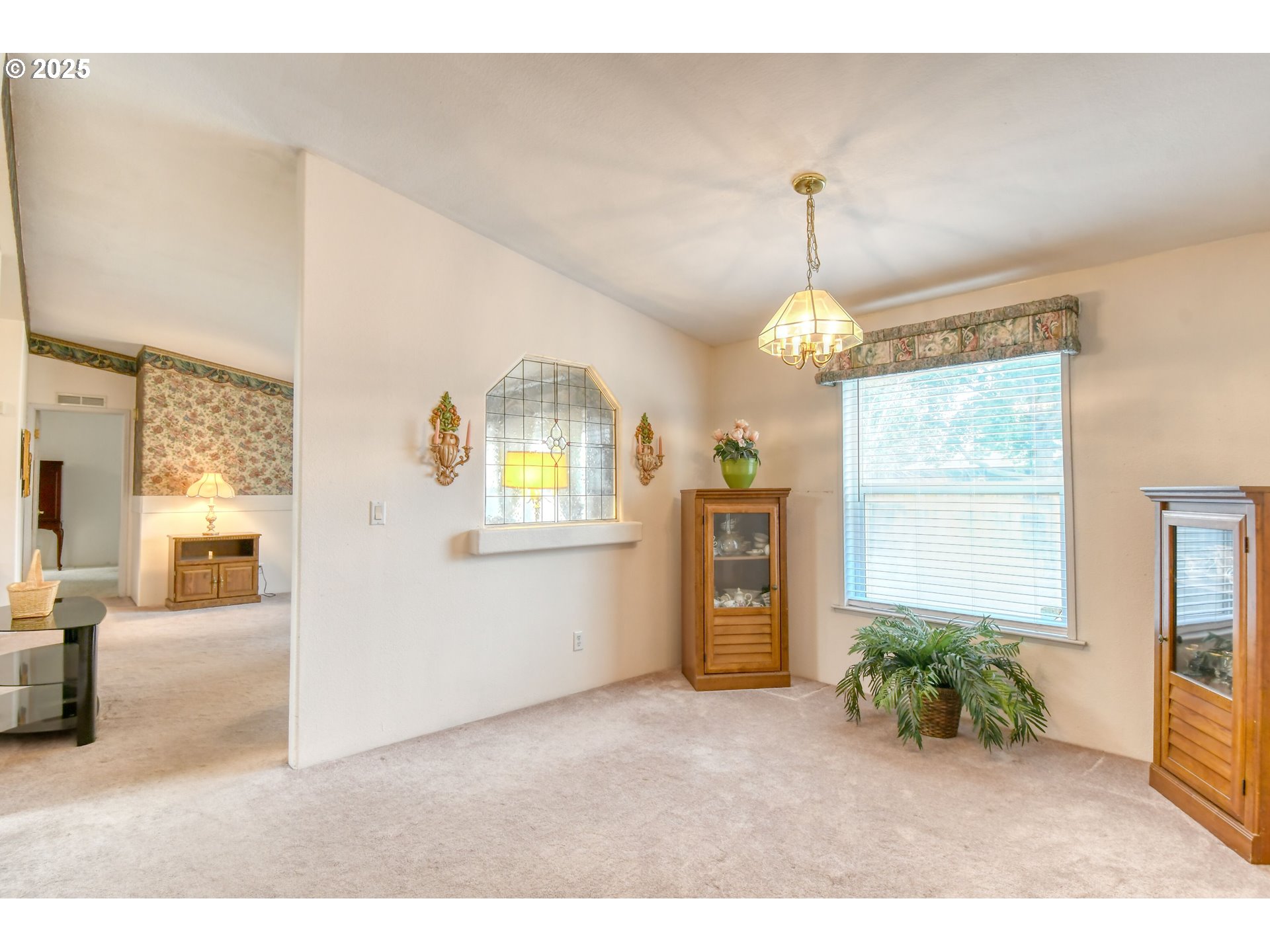 415 Northeast 40th Street Pendleton, OR 97801 - Photo 10 of 36 a living room with furniture and a chandelier
