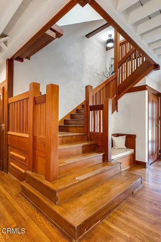 a view of entryway and hall with wooden floor