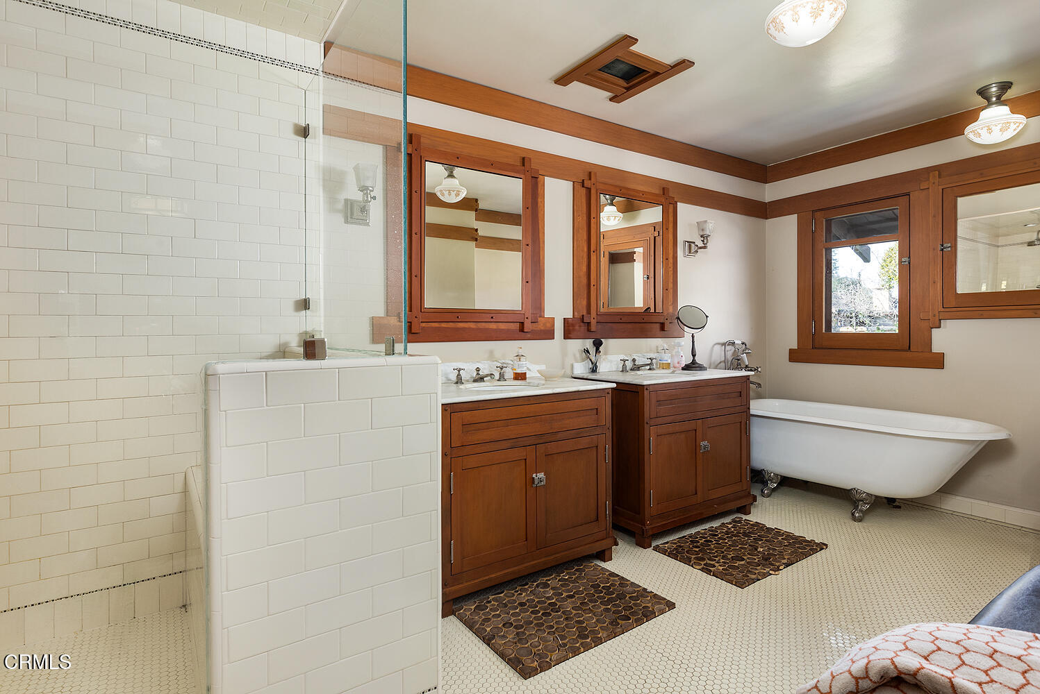 1344 Hillcrest Avenue Pasadena, CA 91106 - Photo 16 of 23 a spacious bathroom with a tub sink and mirror