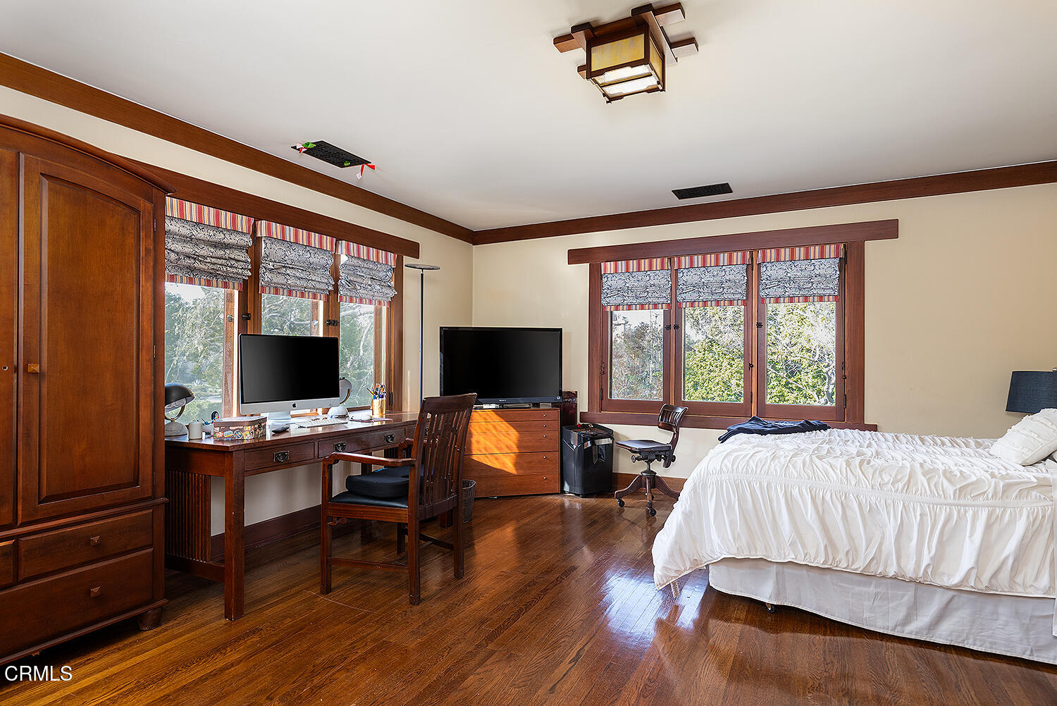 1344 Hillcrest Avenue Pasadena, CA 91106 - Photo 17 of 23 a bedroom with a bed and a flat screen tv with wooden floor