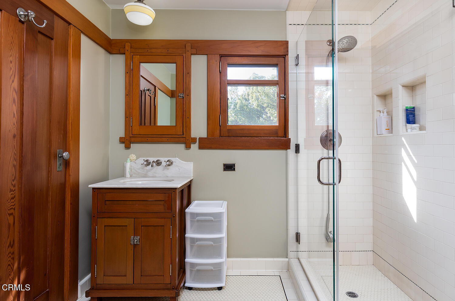 1344 Hillcrest Avenue Pasadena, CA 91106 - Photo 18 of 23 a bathroom with a shower a sink and a mirror