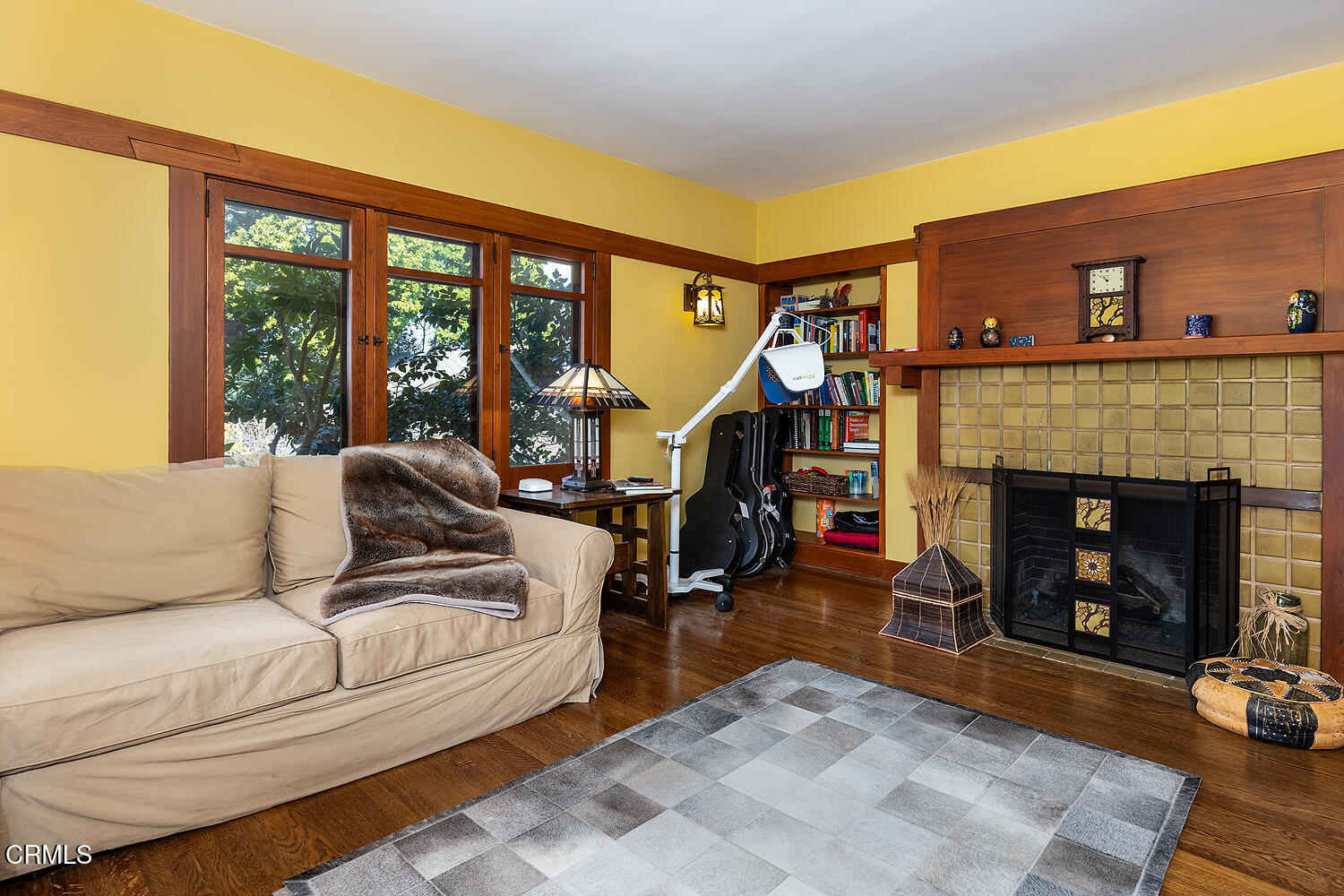 1344 Hillcrest Avenue Pasadena, CA 91106 - Photo 8 of 23 a living room with furniture a fireplace and a floor to ceiling window
