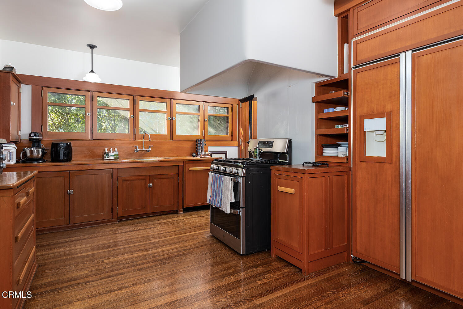 1344 Hillcrest Avenue Pasadena, CA 91106 - Photo 10 of 23 a kitchen with stainless steel appliances kitchen island granite countertop a sink cabinets and wooden floor