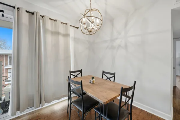 a kitchen with white cabinets stainless steel appliances and sink