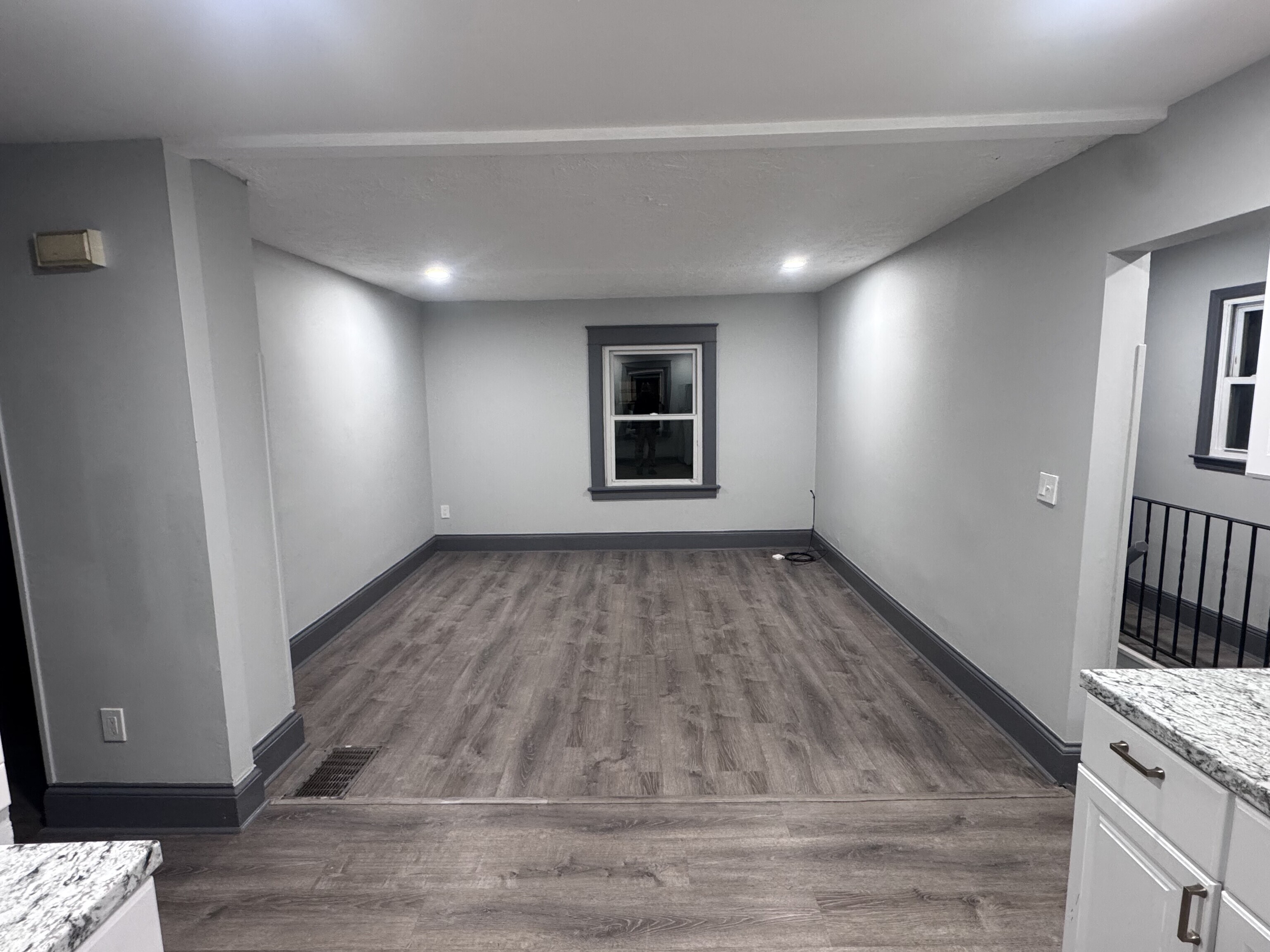 95 New Canaan Avenue, Unit 2 Norwalk, CT 06850 - Photo 5 of 8 a view of an empty room with wooden floor and a window